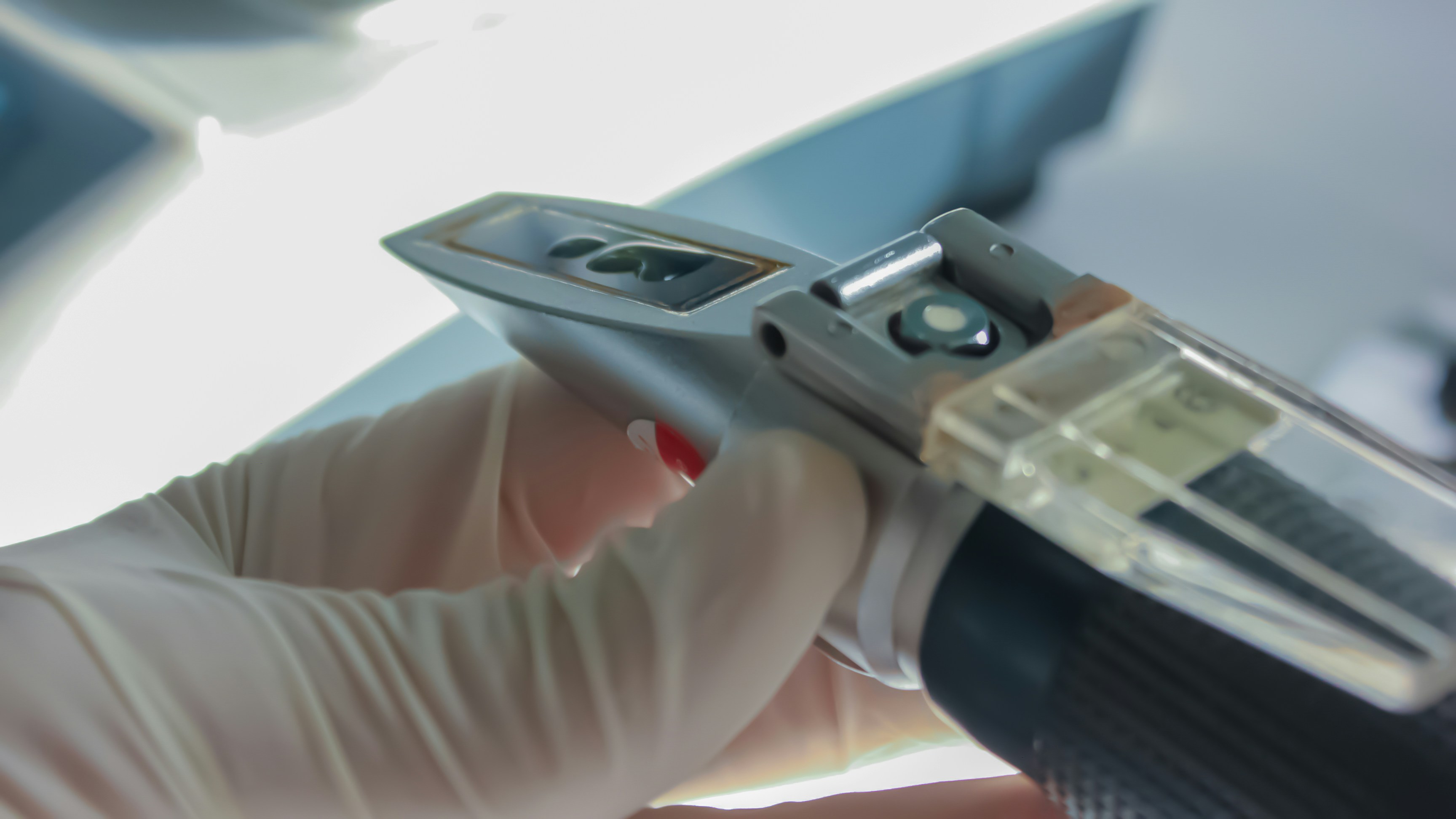 Technician using a tablet to check electric vehicle battery diagnostics