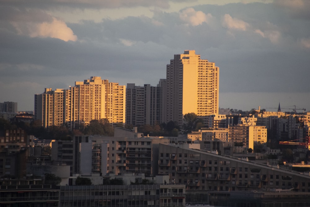 city skyline under cloudy sky during daytime