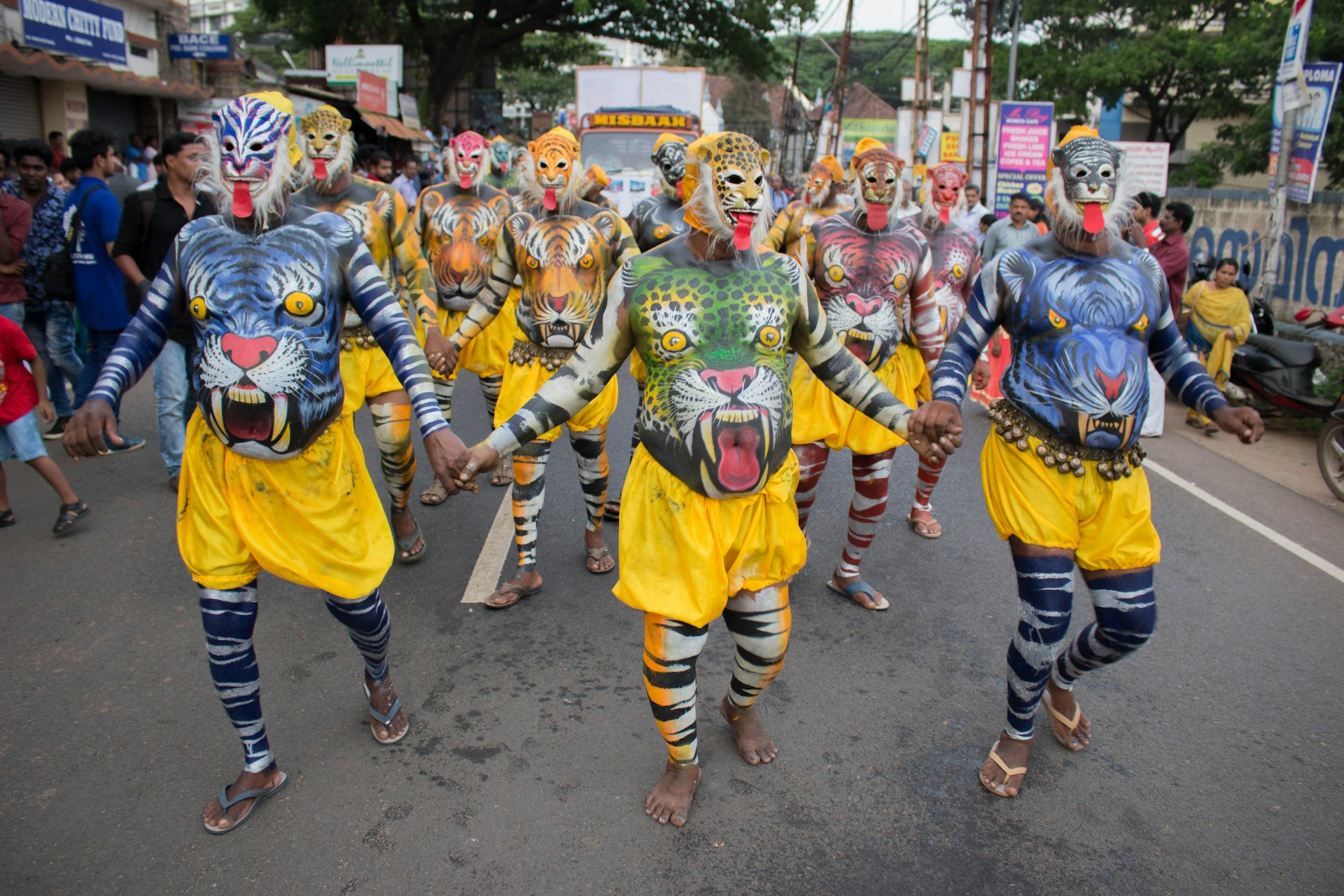 group of people wearing yellow and blue costume