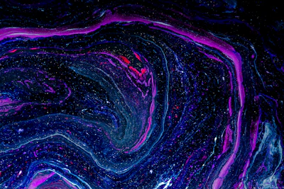 A swirling galaxy of deep indigo and amethyst hues with golden stars scattered across.