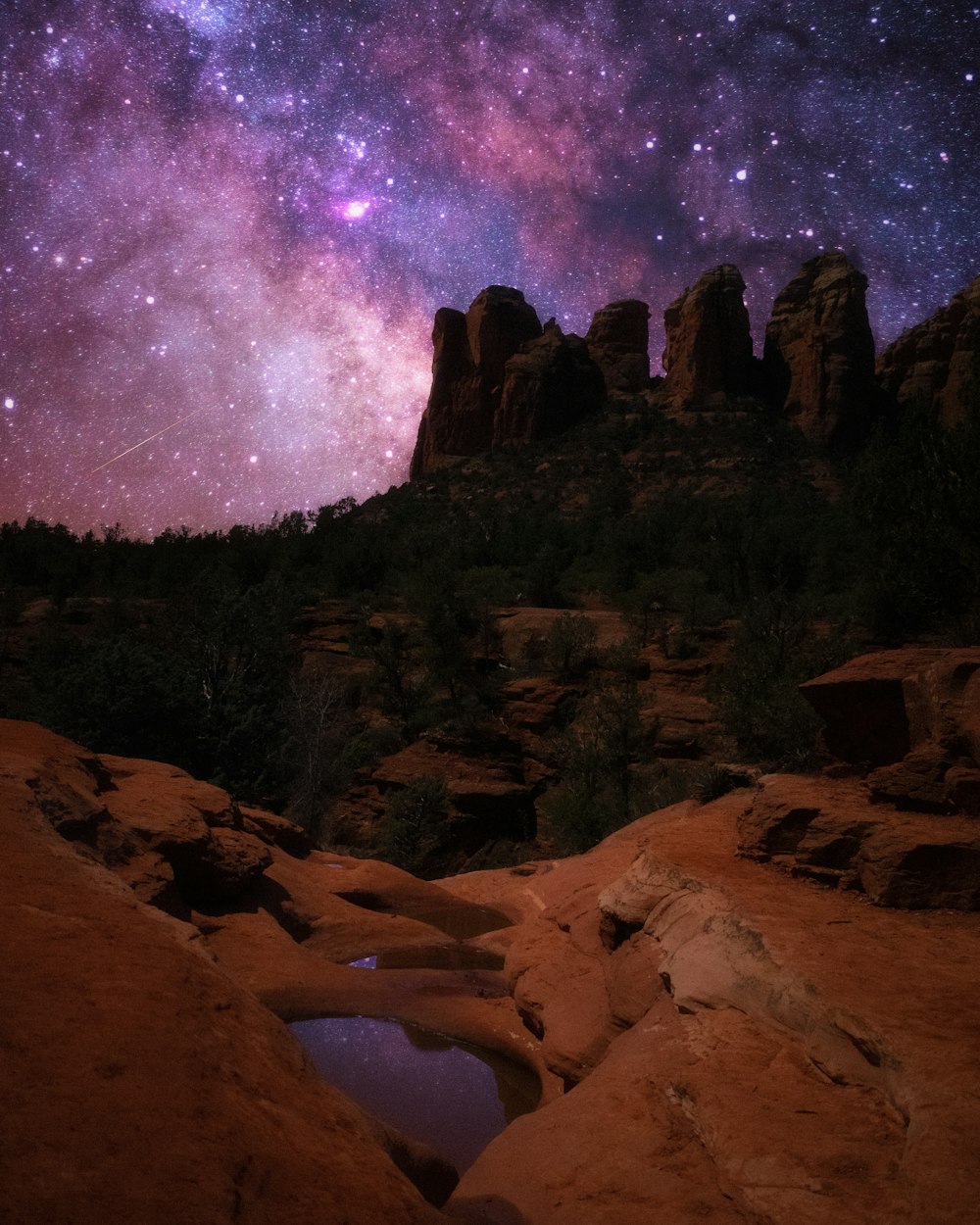 brown rocky mountain under purple sky