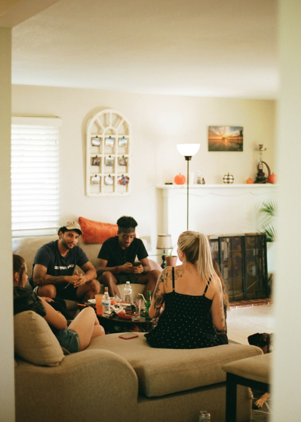 3 women and 2 men sitting on couch