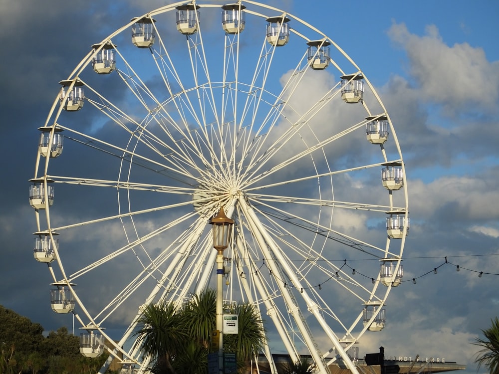 white ferris wheel under blue sky during daytime