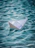 white paper boat on water