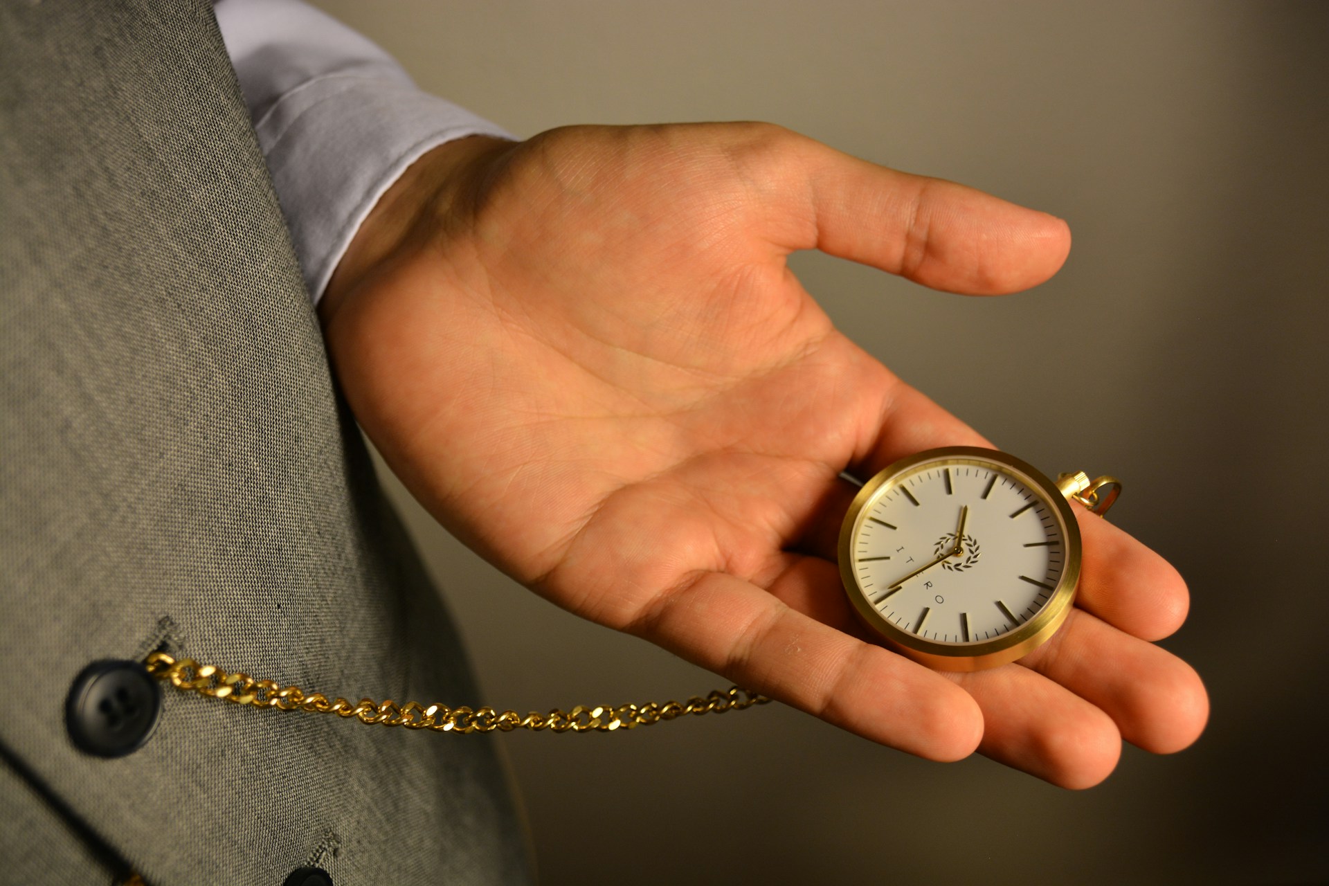 gold and silver round analog watch