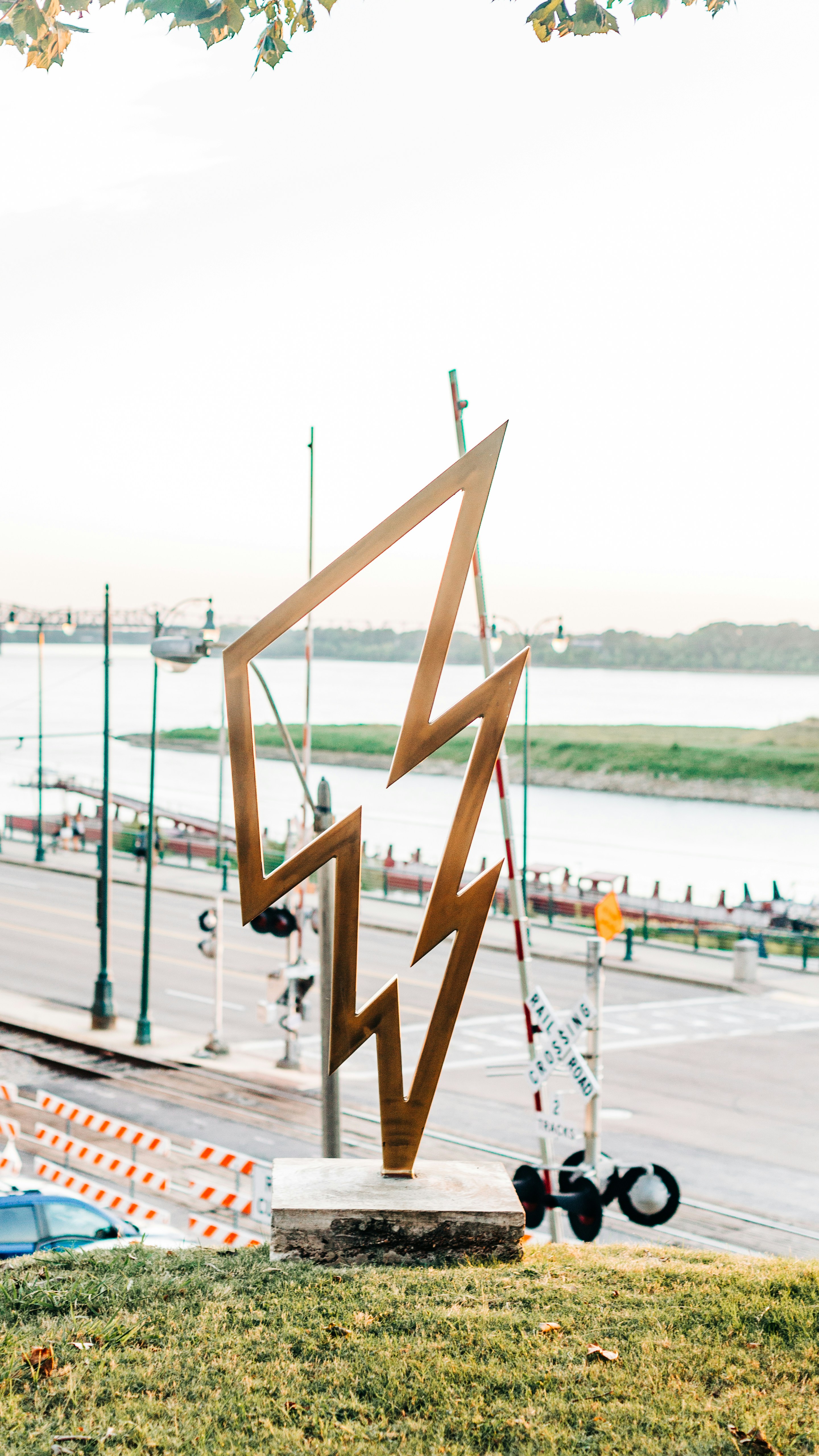 brown wooden clothes hanger on gray concrete floor during daytime
