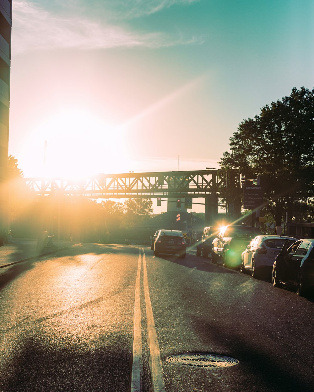 cars on road during sunset