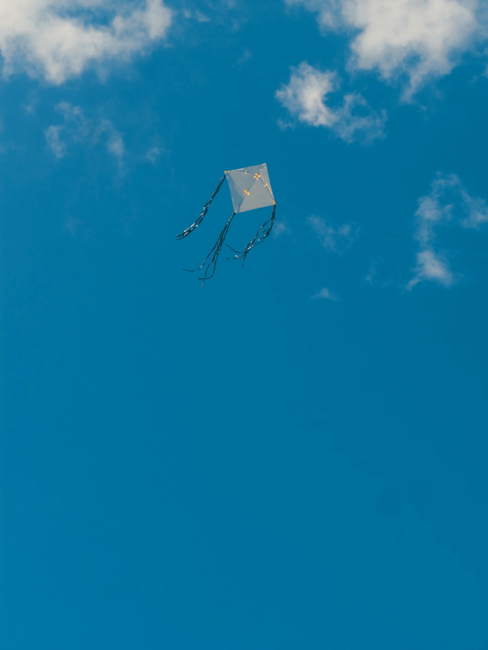 white and black basketball hoop under blue sky