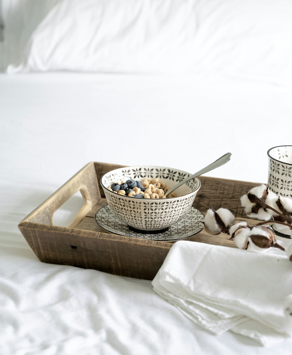 white ceramic mug on brown wooden tray