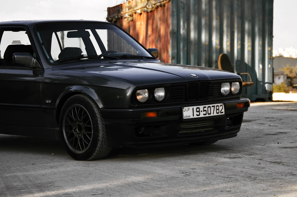 black bmw m 3 parked on gray asphalt road during daytime