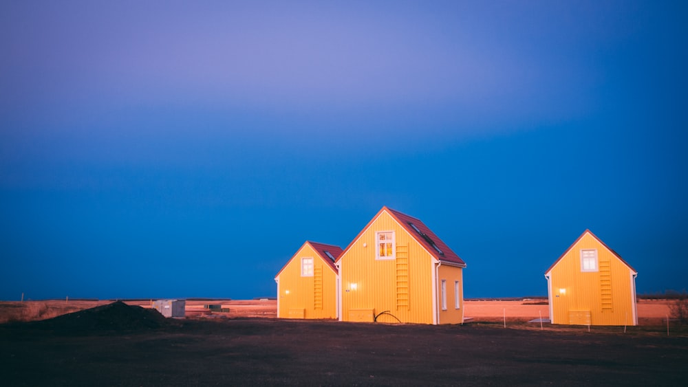 red and yellow wooden houses under blue sky during daytime