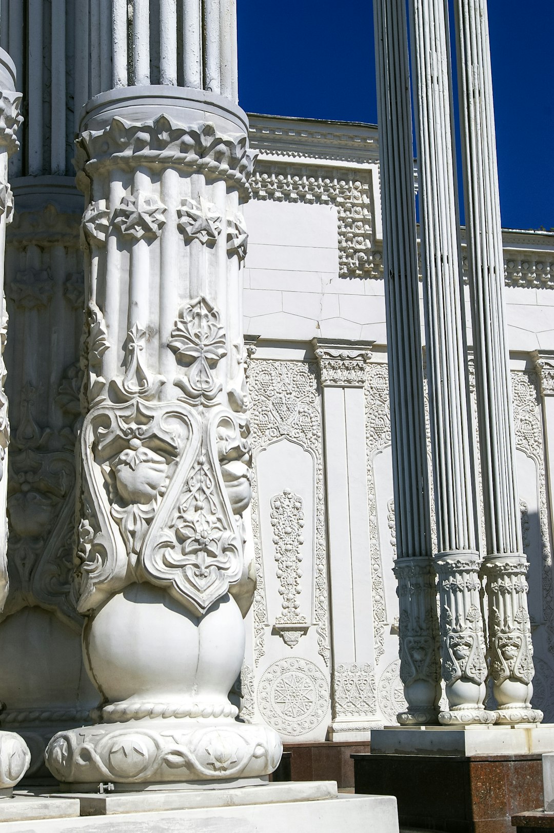 white concrete statue of woman