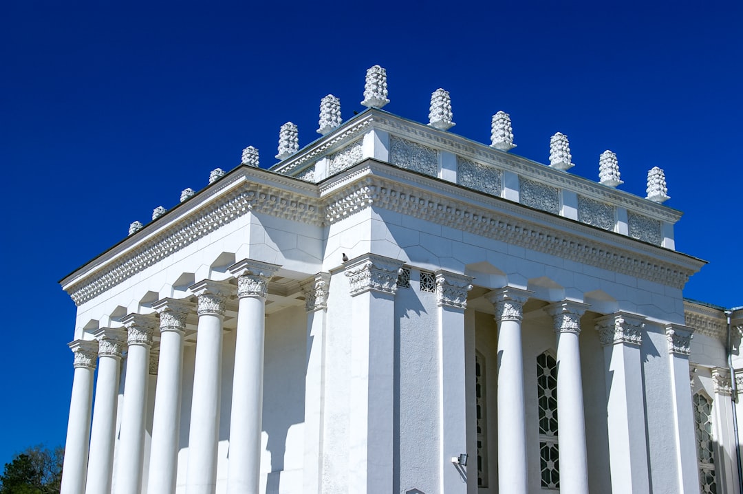 white concrete building under blue sky during daytime