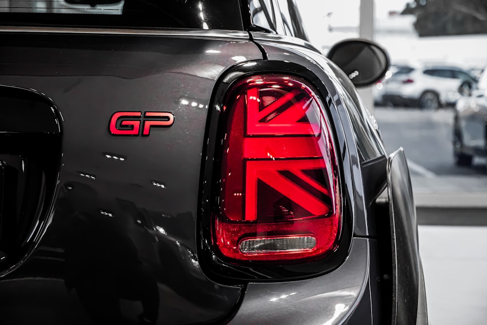 black and red car in grayscale photography