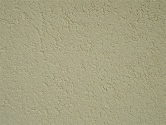 Close-up of textured wall finishes and decorative foam designs.