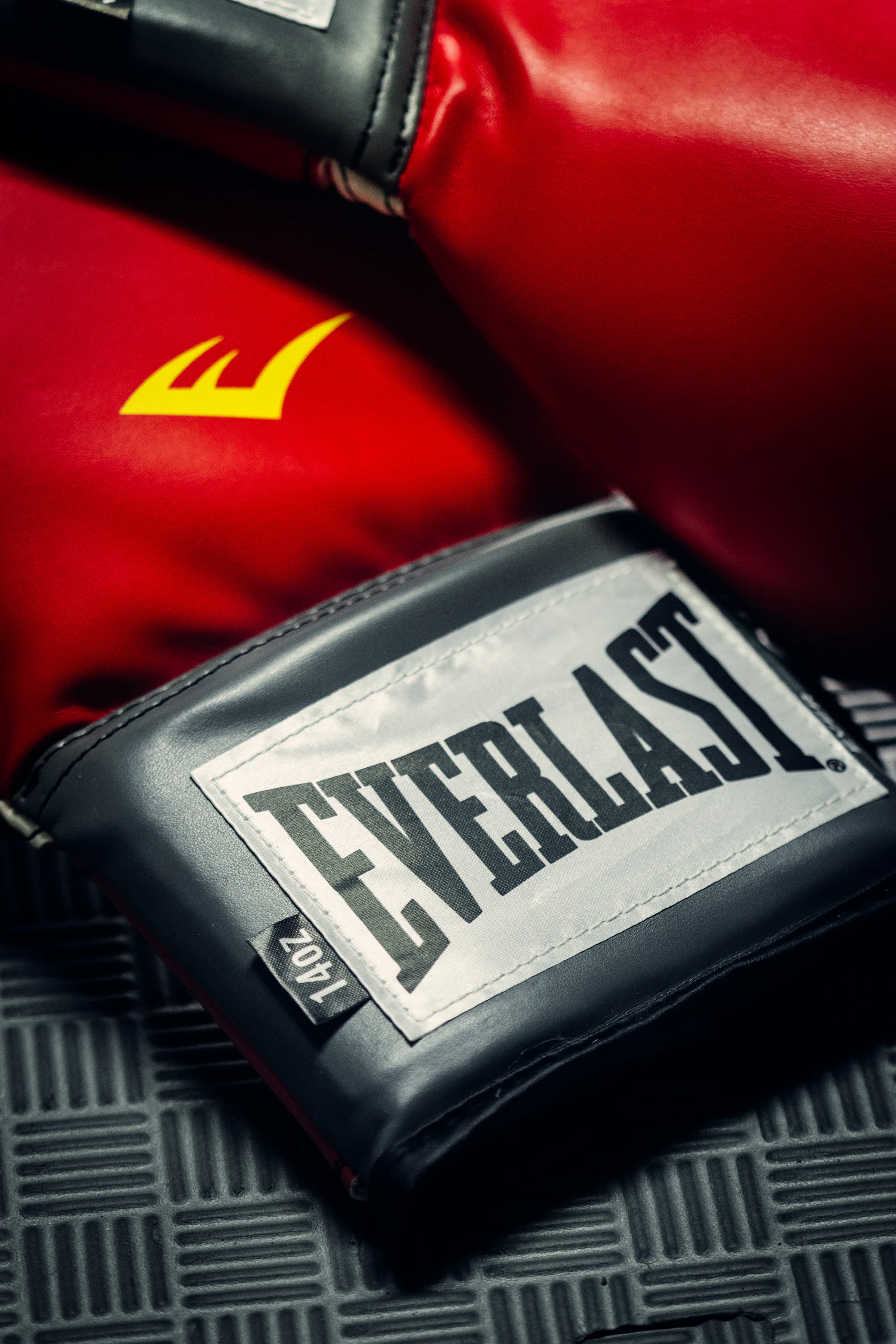 Close-up of red and black leather Muay Thai gloves