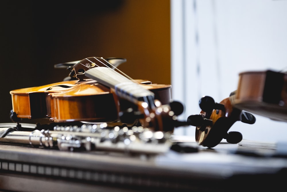 brown violin on table in room