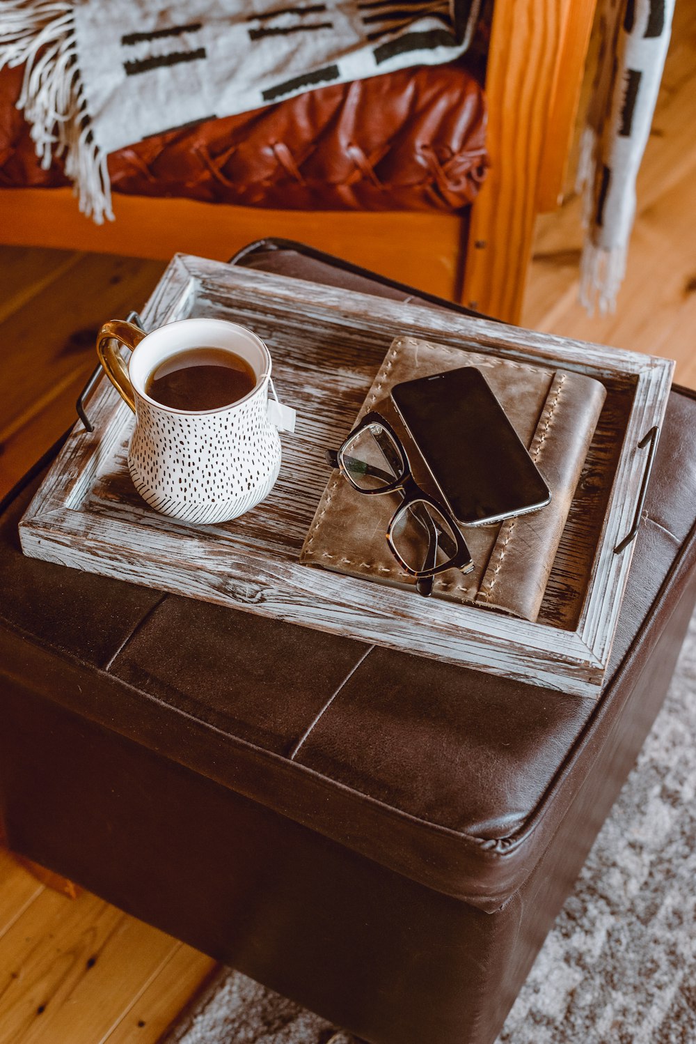 white ceramic mug on brown wooden table