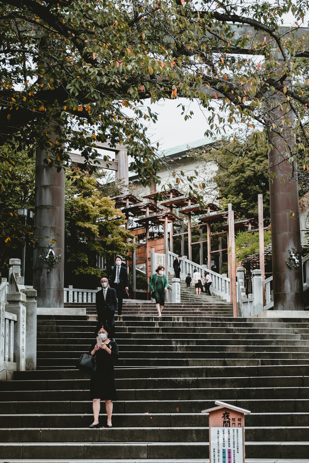 people walking on stairs near building during daytime