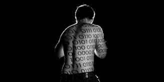 man in black shorts with black background