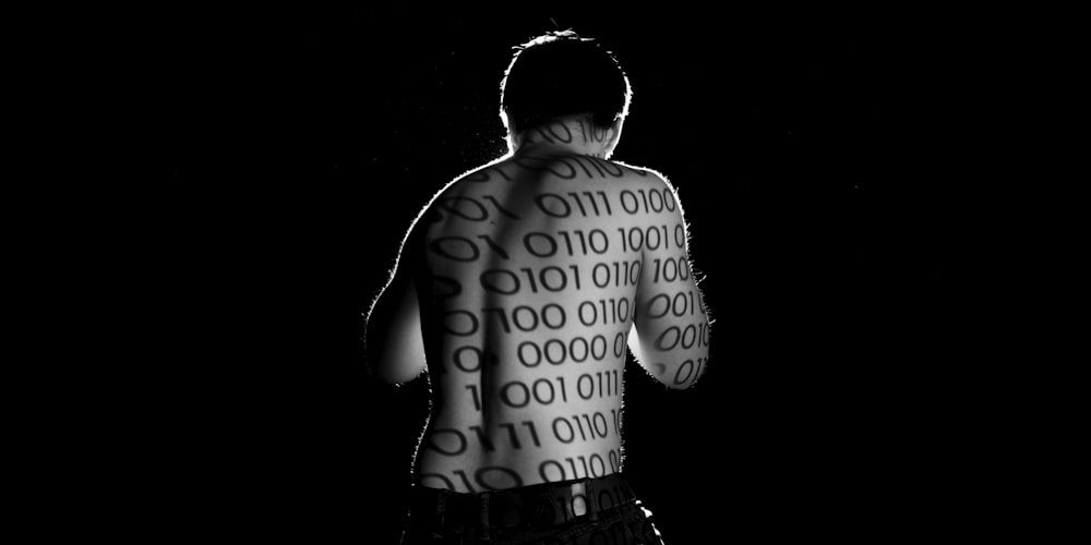 man in black shorts with black background