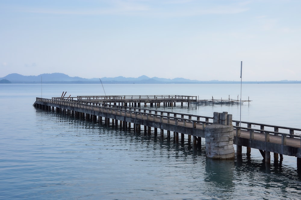 brown wooden dock on sea during daytime