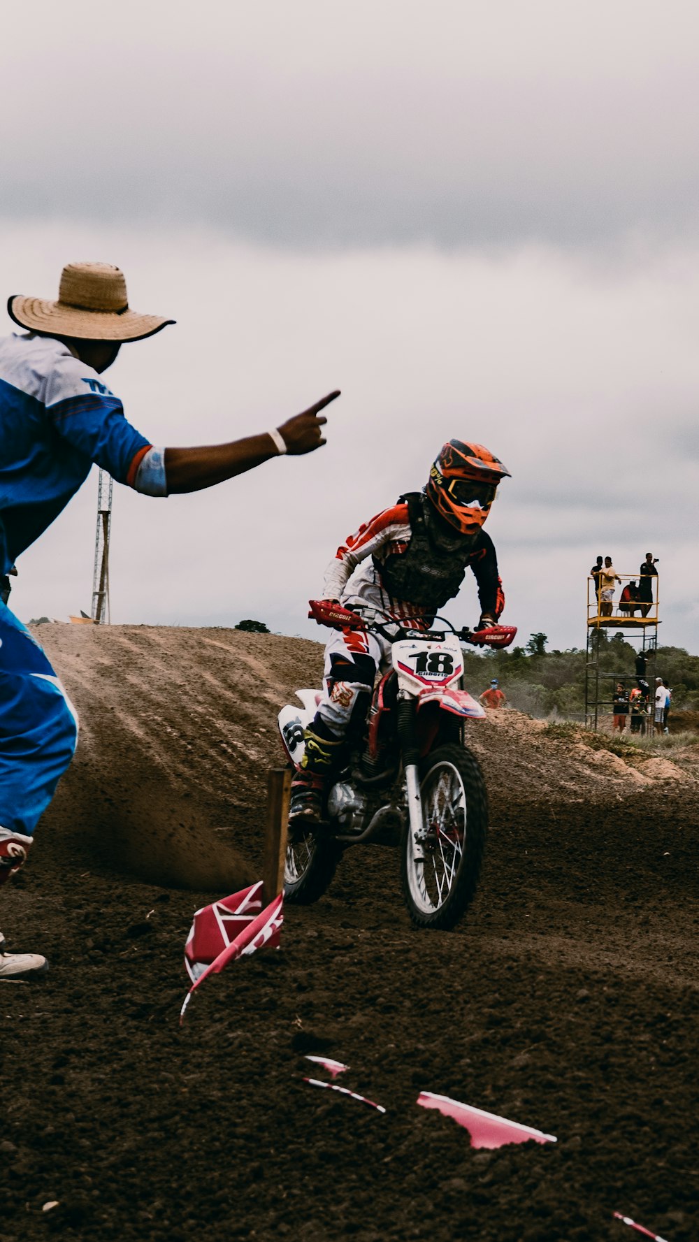 man in blue jacket riding motocross dirt bike