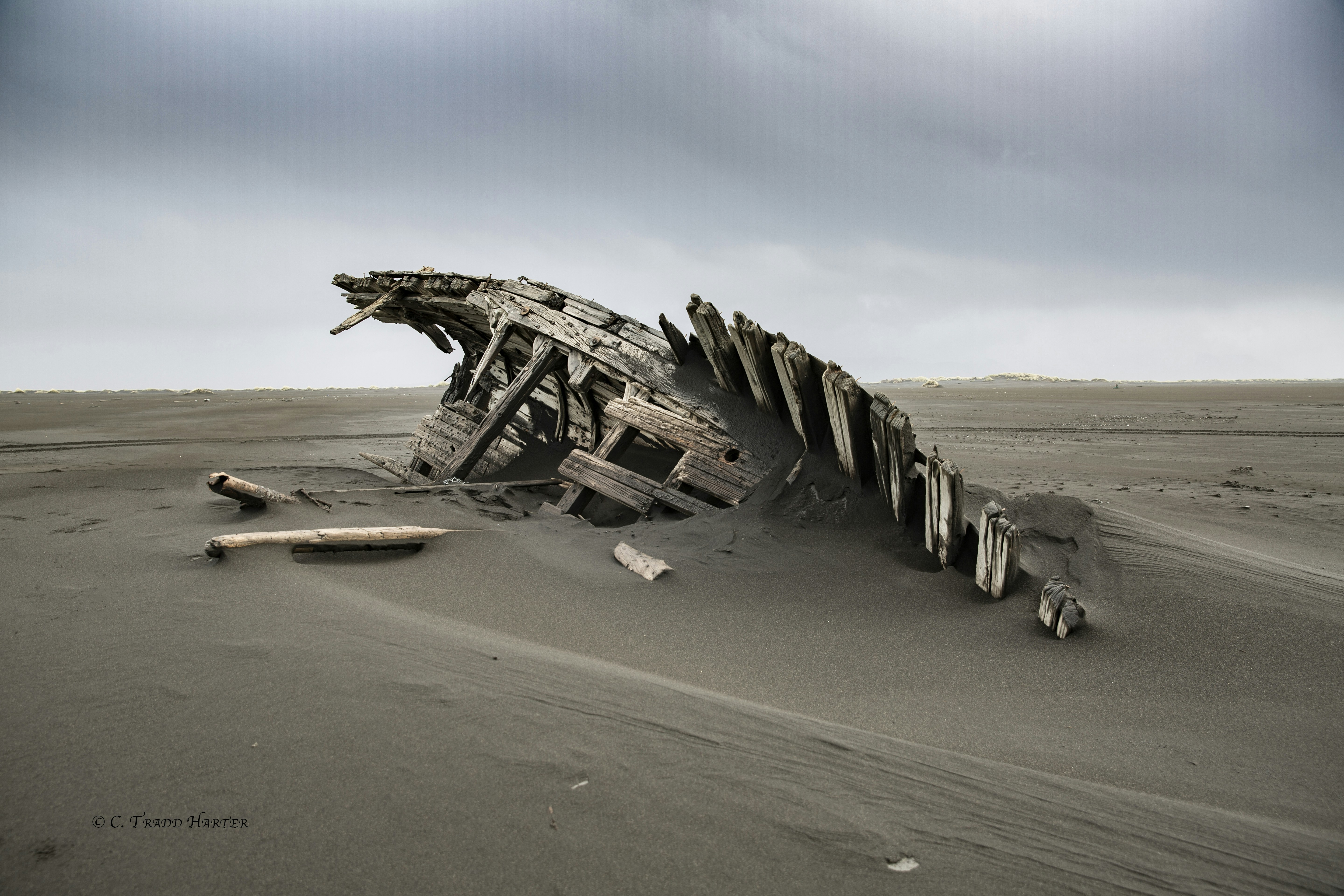 wrecked brown wooden ship on brown sand during daytime, 