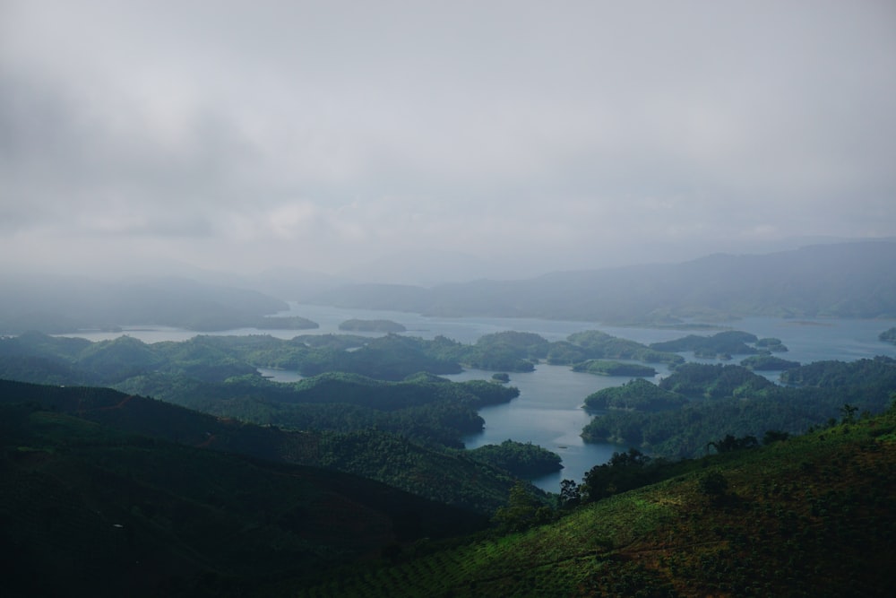 green mountains under white clouds during daytime