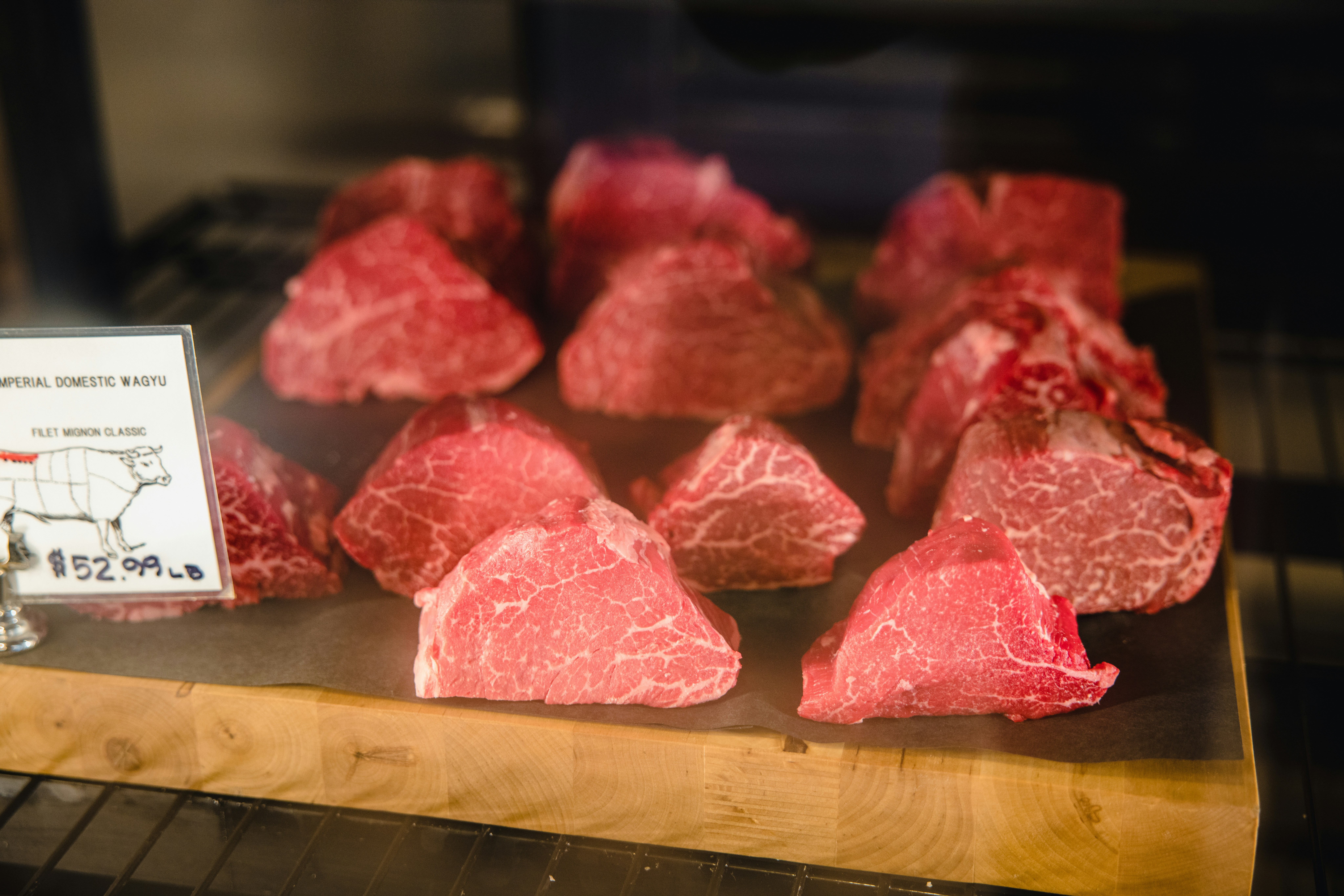 raw meat on brown wooden table