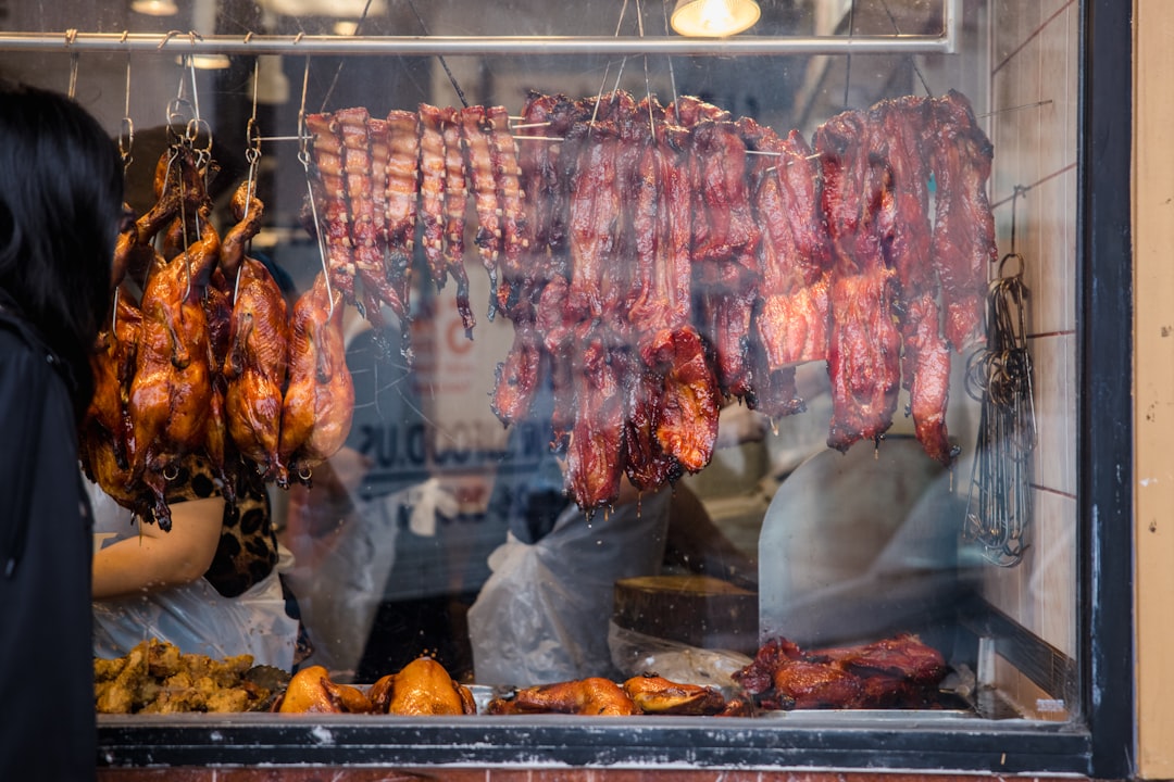 meat on clear glass display counter