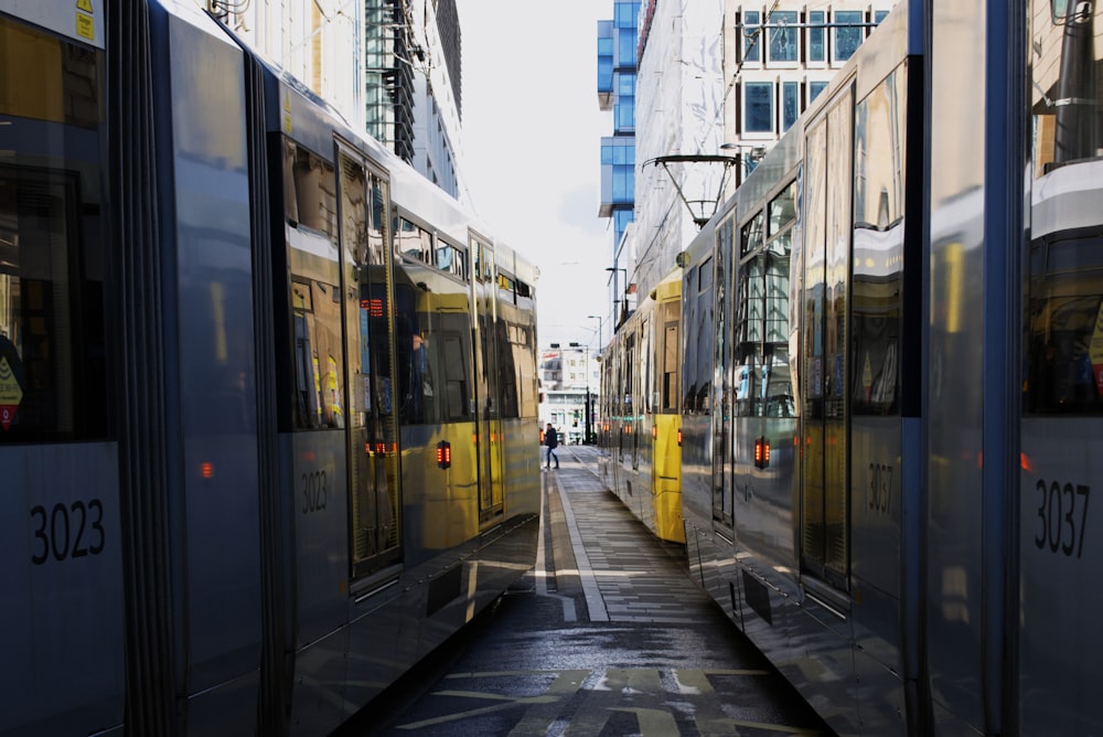 white and black train on the street during daytime