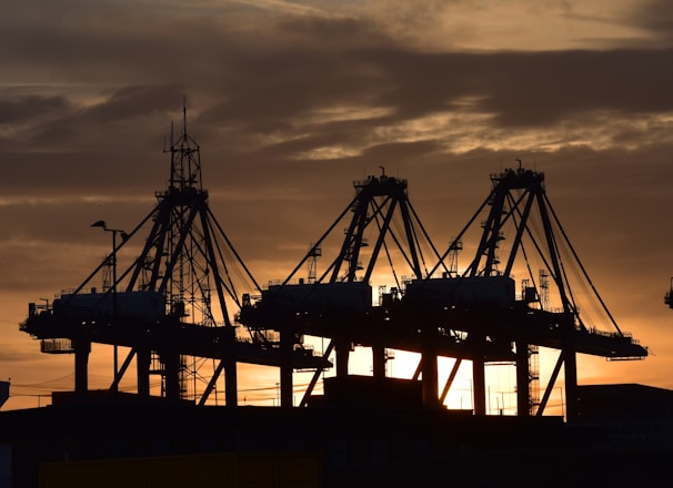 silhouette of cargo ship during sunset