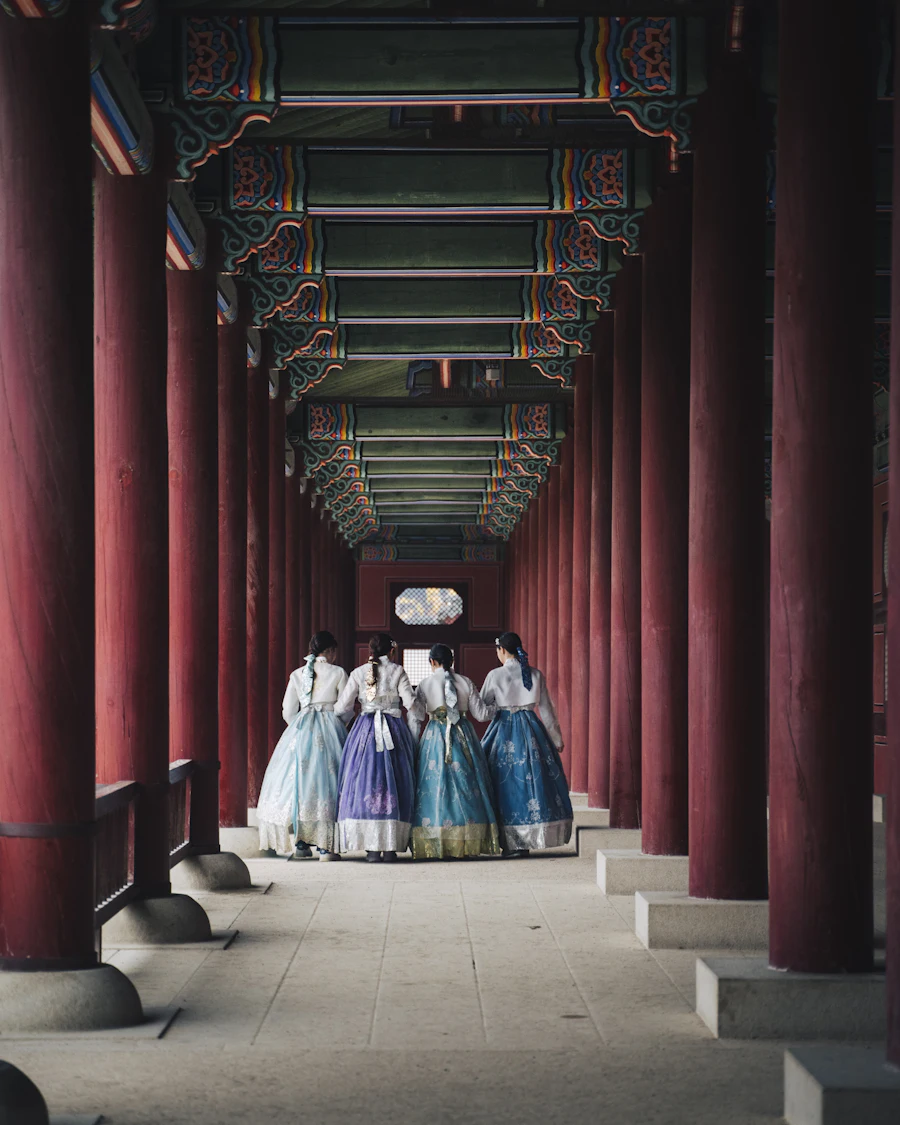 Women in hanbok at a palace corridor in Seoul, South Korea