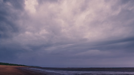 ocean under cloudy sky during daytime in Bhavnagar India