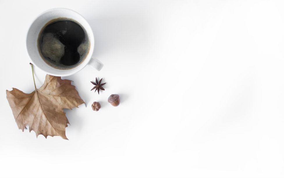 white ceramic mug with black liquid