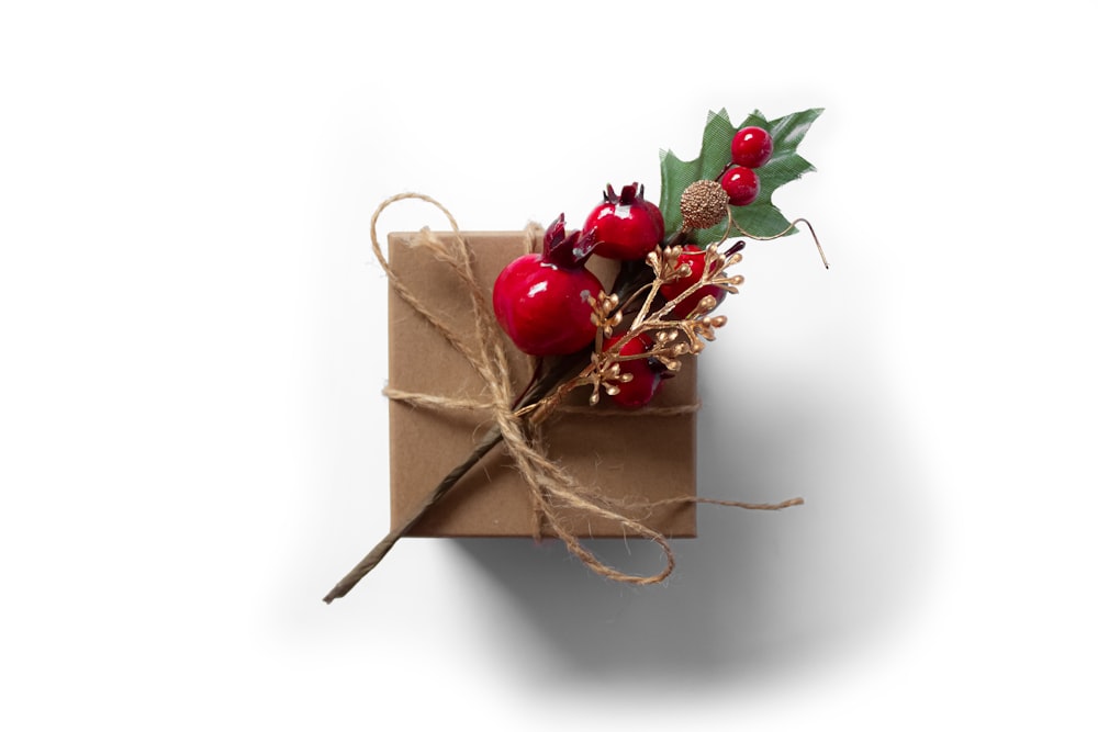 red cherries on brown gift box