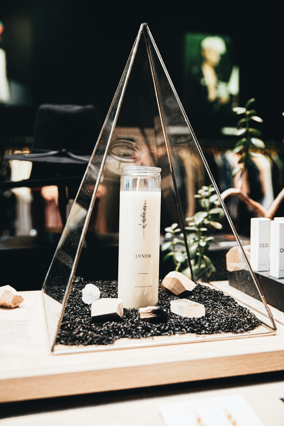 clear glass bottle on black and white marble table