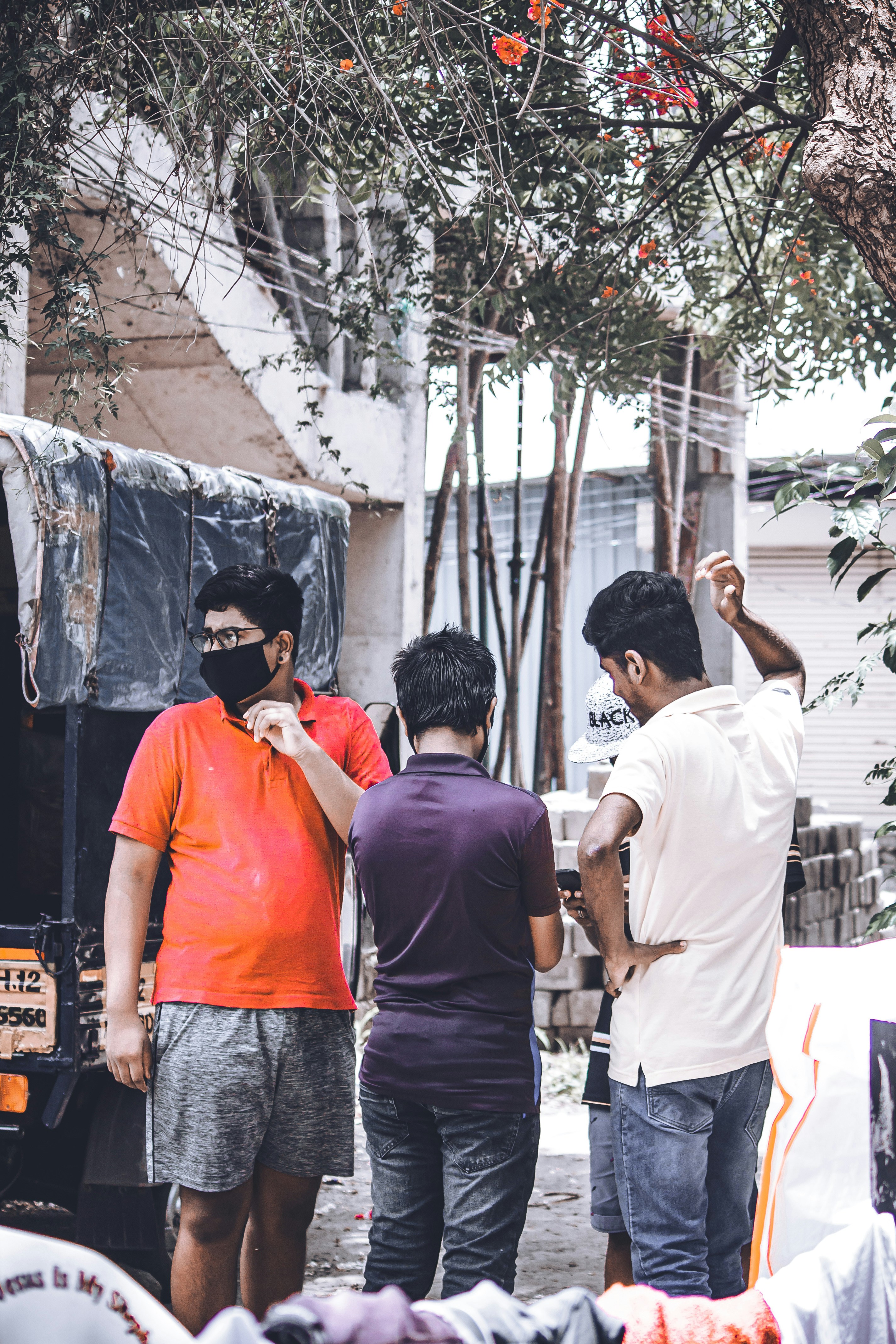 man in white t-shirt standing beside man in white t-shirt