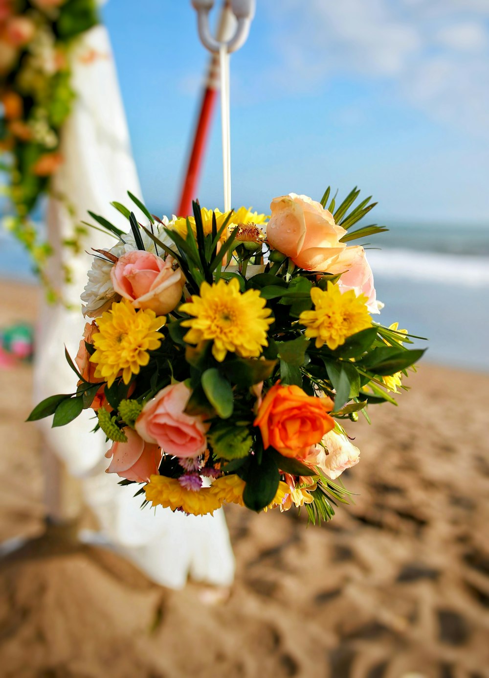 yellow white and red flower bouquet