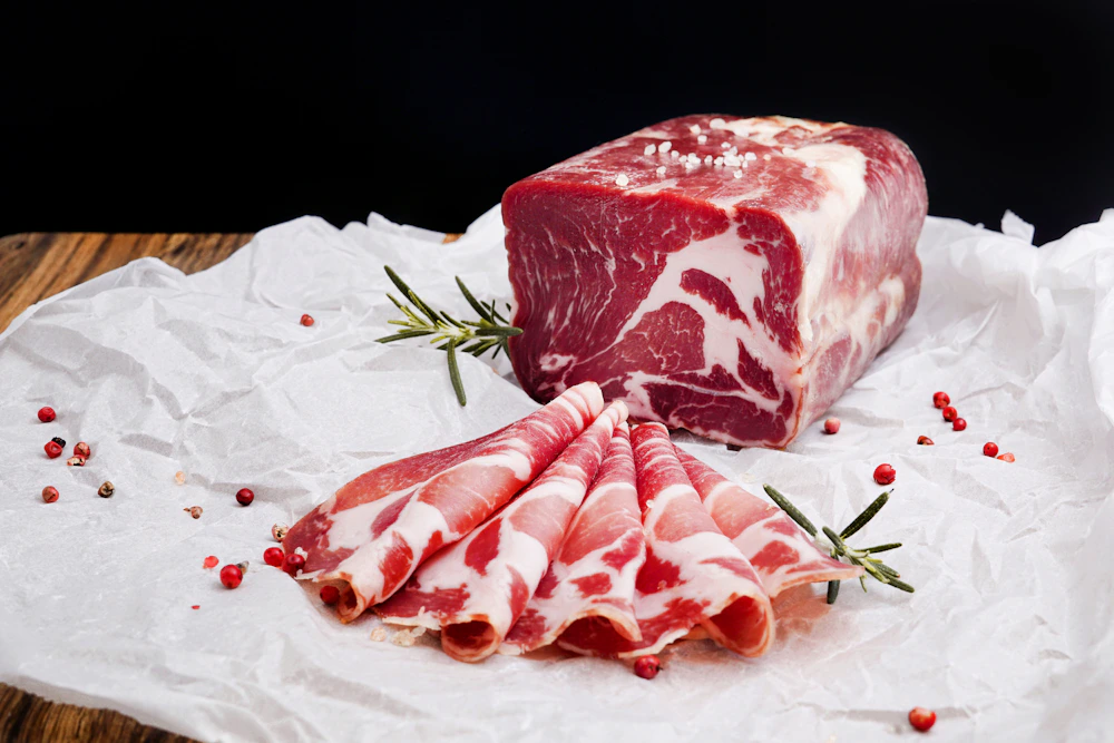 Fresh raw meat laid out on white butcher paper
