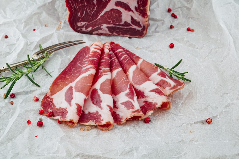 raw meat on white ceramic plate