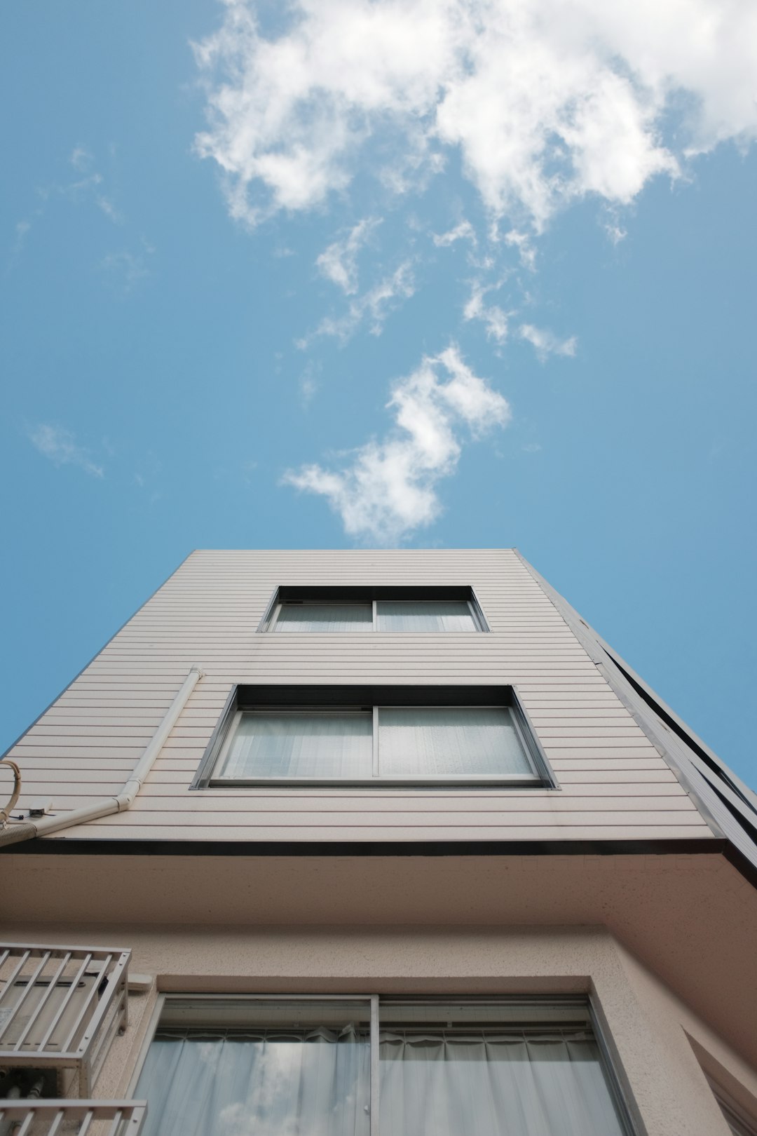 white and brown concrete building under blue sky during daytime