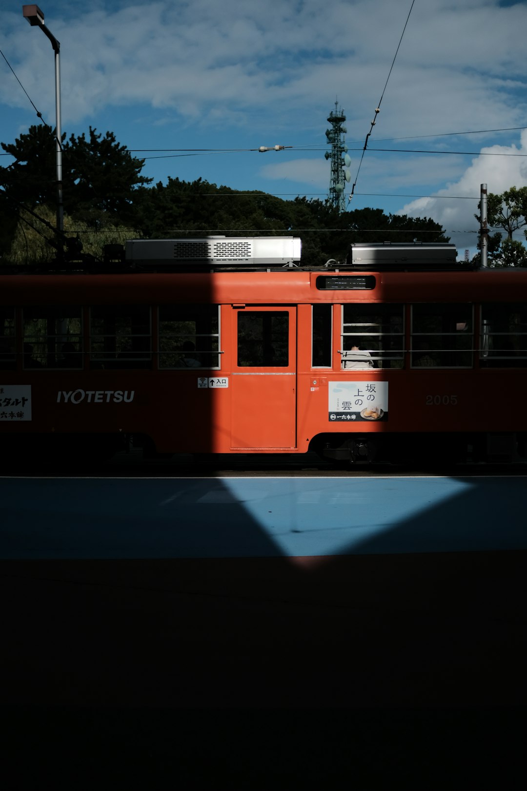 red and white train on road