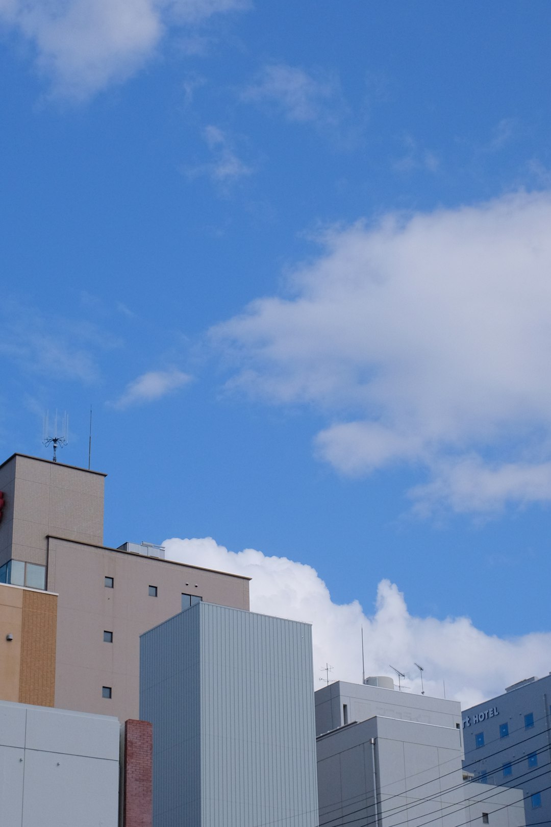 white concrete building under blue sky during daytime