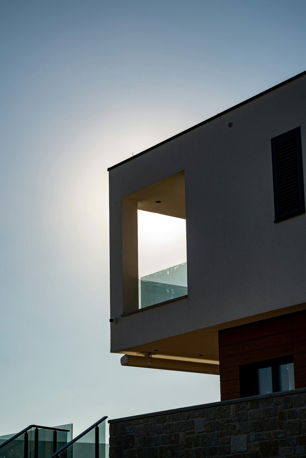 white concrete building with glass window