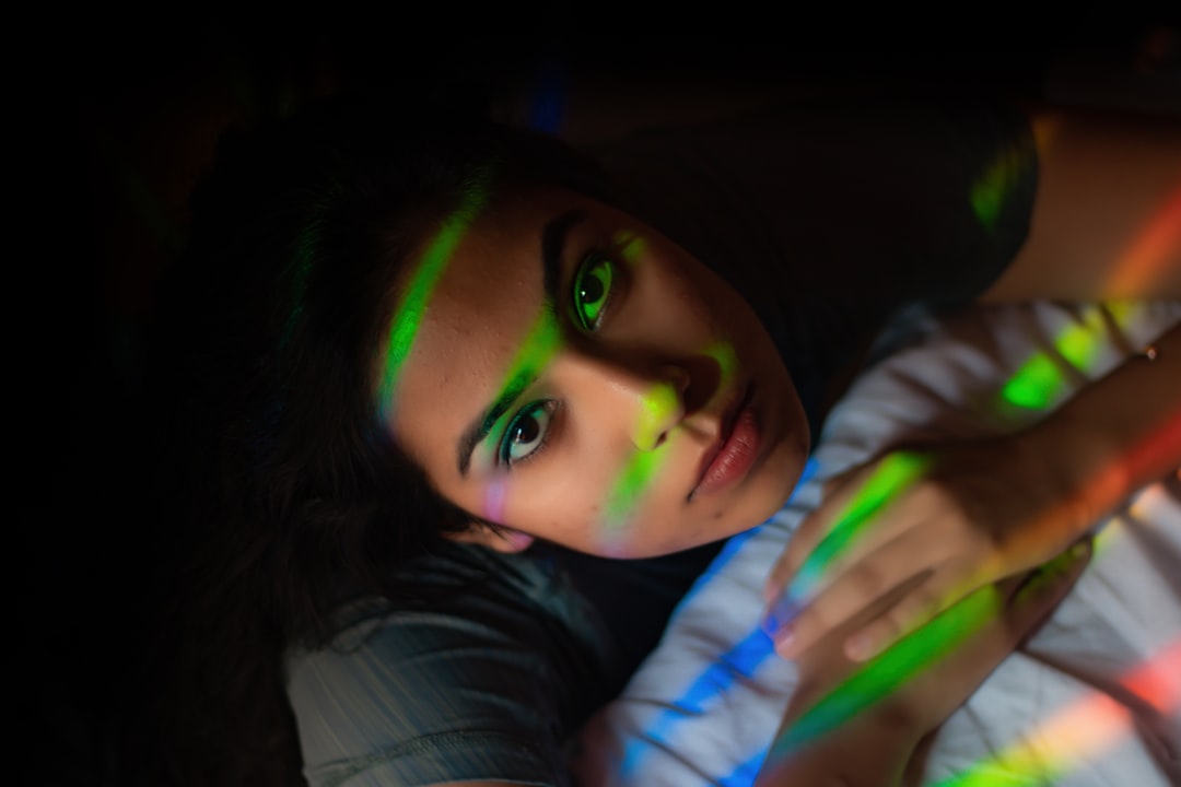 girl with green eyes wearing white and blue long sleeve shirt,
