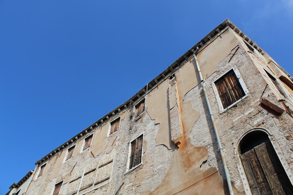 brown concrete building under blue sky during daytime