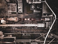 An aerial view of a chemical plant with insulated pipes.
