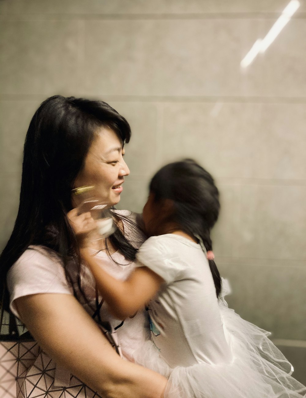 woman in white shirt kissing woman in white shirt